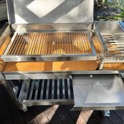 Tagwood BBQ Freestanding Argentine Wood Fire & Charcoal Gaucho Grill BBQ18SS stainless steel with adjustable grates and spacious cooking area.