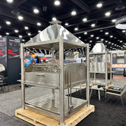 Tagwood BBQ XL Argentine Santa Maria Wood Fire & Charcoal Grill in stainless steel with height-adjustable grates and gaucho-style brasero.