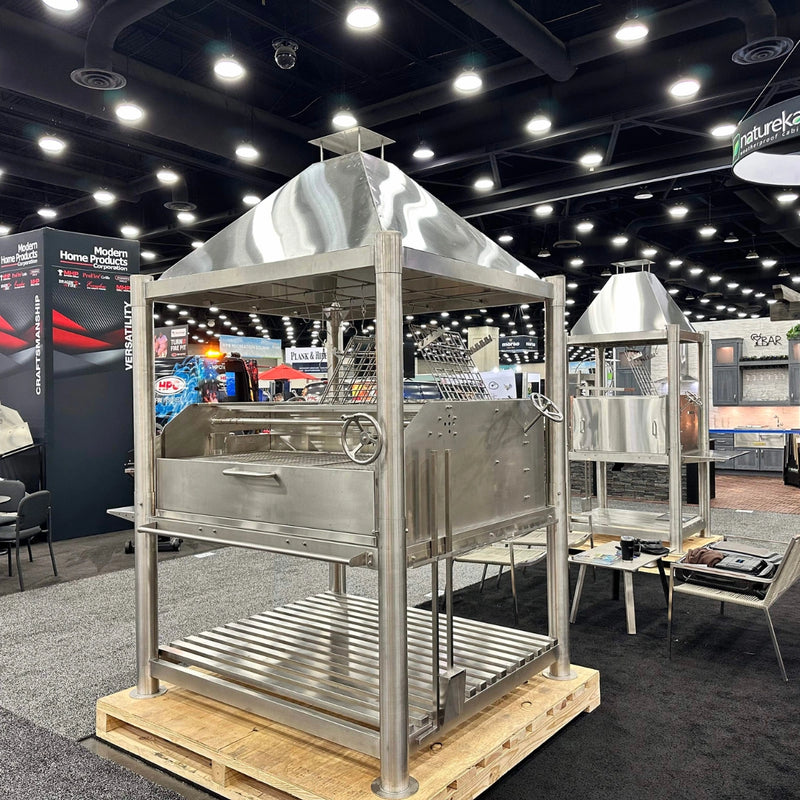 Tagwood BBQ XL Argentine Santa Maria Wood Fire & Charcoal Grill in stainless steel with height-adjustable grates and gaucho-style brasero.