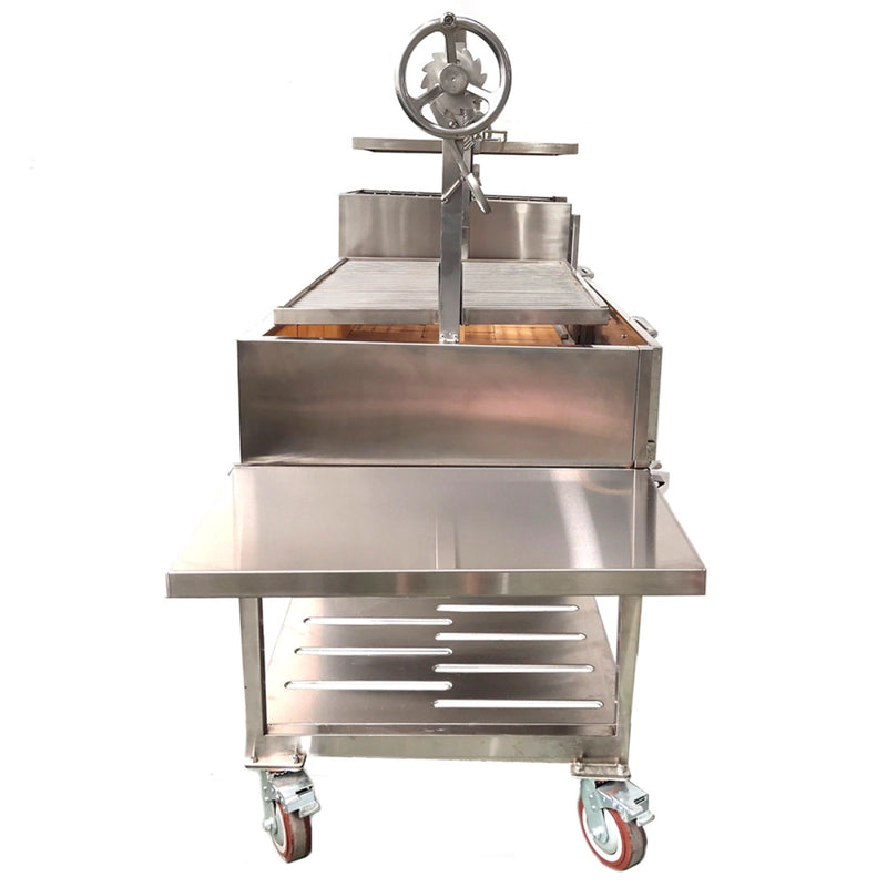Tagwood BBQ XL Freestanding Argentine Santa Maria grill in stainless steel with height-adjustable grates and a peaked roof for outdoor cooking.