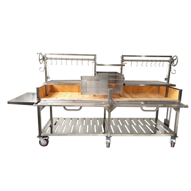 Tagwood BBQ XL Freestanding Argentine Santa Maria Grill with stainless steel, large cooking area, adjustable grates, and side shelves on wheels.