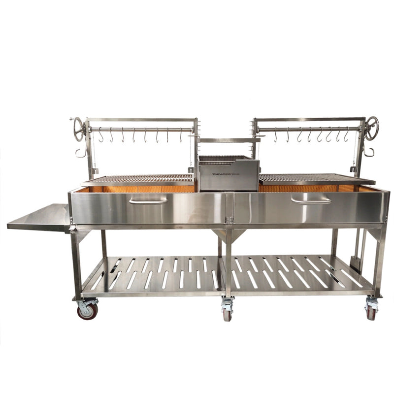Tagwood BBQ XL Freestanding Argentine Santa Maria grill with stainless steel, double cooking space, height-adjustable grates, and side shelf.