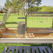 Tagwood BBQ XL Freestanding Argentine Santa Maria Grill in stainless steel with adjustable grates and gaucho-style firebox for wood and charcoal cooking