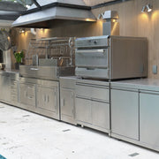 Tagwood BBQ XL Built-In Santa Maria Argentine Wood Fire & Charcoal Gaucho Grill in stainless steel with large cooking surface and peaked roof