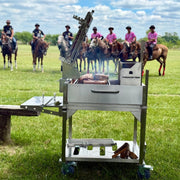 Tagwood BBQ Freestanding Argentine Charcoal Gaucho Grill BBQ33SS with stainless steel, firebox, clamp grill, portable design, and side shelf.