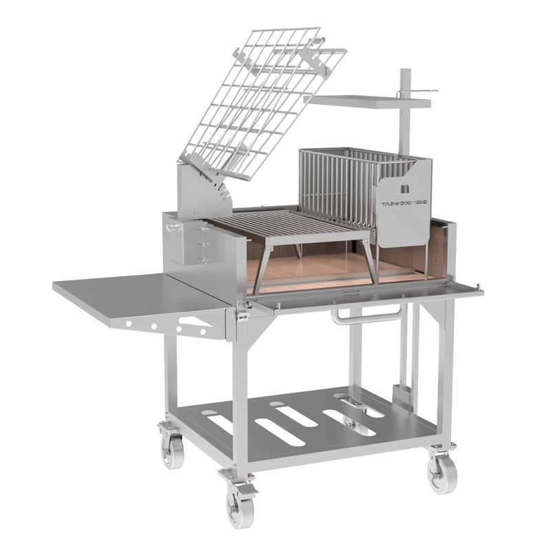 Tagwood BBQ Freestanding Argentine Charcoal Gaucho Grill BBQ33SS in stainless steel with clamp grill, firebox, side shelf, and caster wheels.