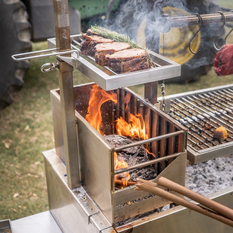 Tagwood BBQ Height Adjustable Secondary Grate BBQ55SS made of stainless steel with adjustable height over firebox for direct flame cooking.