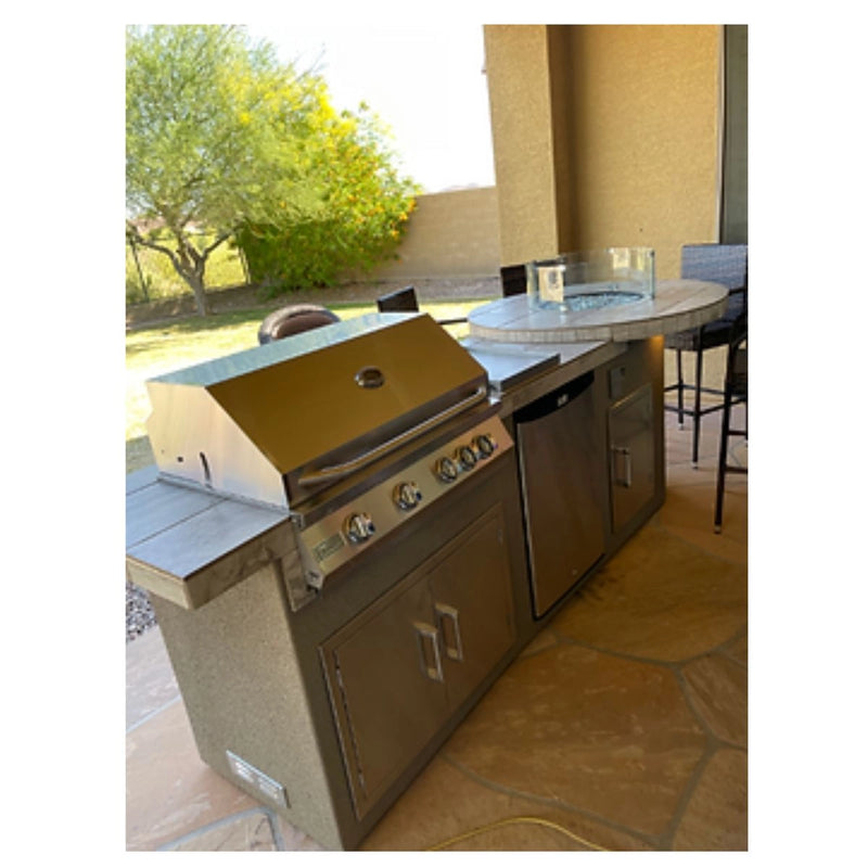 Kokomo Grills Fire 9' BBQ Island with 4 foot round bar, 4-burner stainless steel grill, under-counter lighting, and stucco finish.