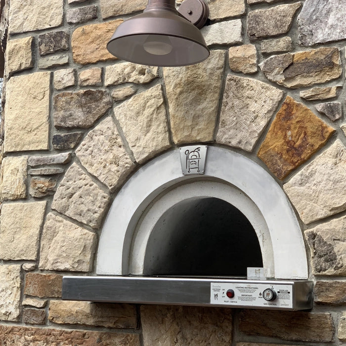 HPC Fire Inspired Di Napoli Series built-in dual fuel pizza oven with decorative arched front and stainless steel control panel.