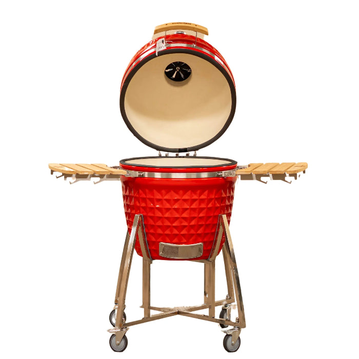 Red ceramic barbecue grill with wooden lid and stand on a white background