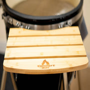Wooden stool with 'ComfortBilt' logo in front of a drum set.