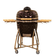 Black ceramic barbecue grill with wooden shelves on a white background