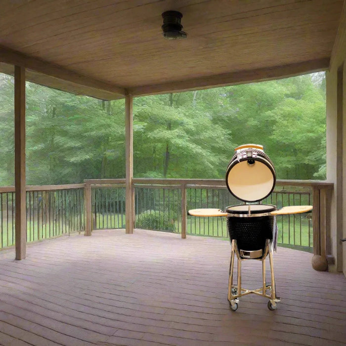 Barbecue grill on a wooden deck with a view of trees