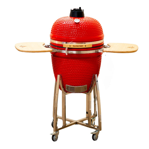 Red ceramic barbecue grill with wooden accents on a white background
