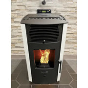 Pellet stove with visible flames against a stone wall background
