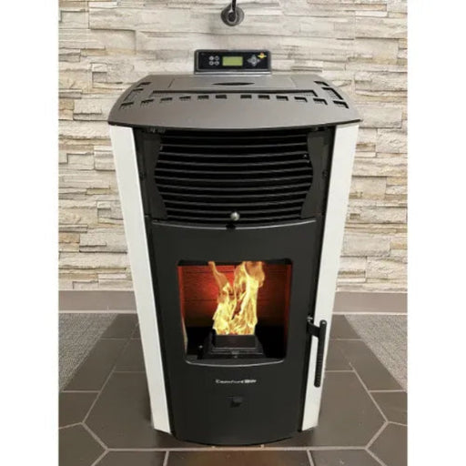 Pellet stove with visible flames against a stone wall background