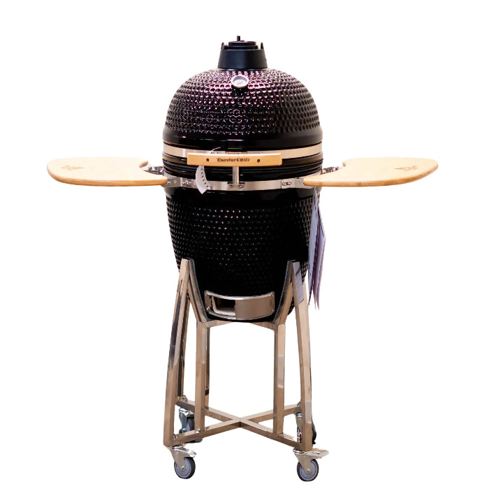 Black Kamado-style grill with wooden cooking platforms on a white background