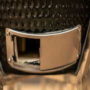 Close-up of a metallic buckle on a textured leather surface