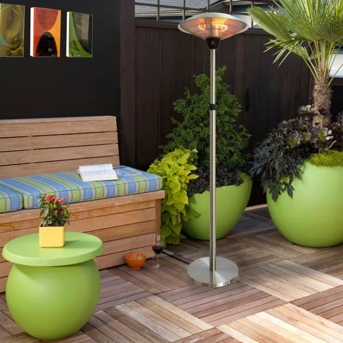 Outdoor patio scene with a wooden bench, green table, potted plants, and a patio heater.