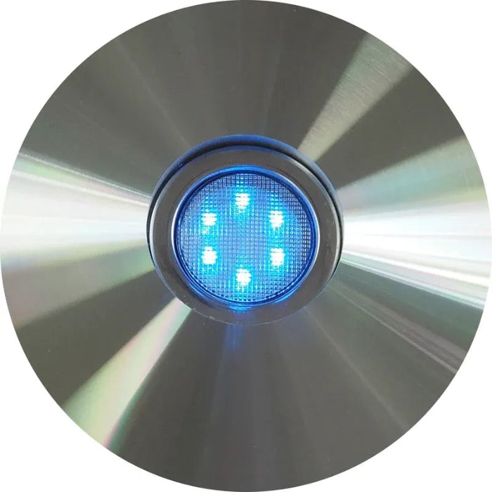 Close-up of a blue LED light on a reflective surface