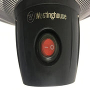 Black Westinghouse light fixture with red switch on a white background