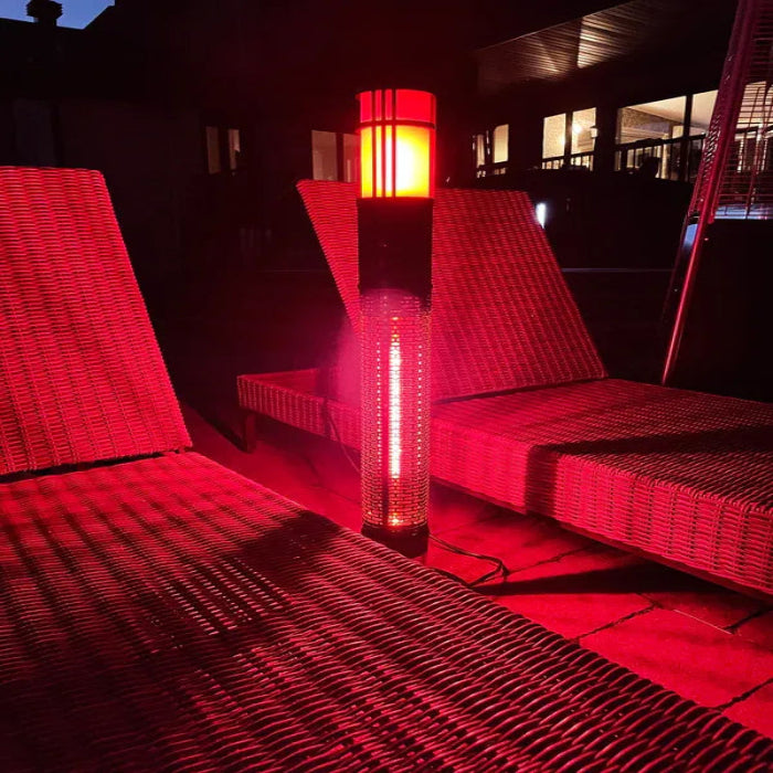 Red wicker chairs with a glowing red lamp on a dark patio