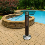 Patio heater on a paved area near a pool with greenery in the background