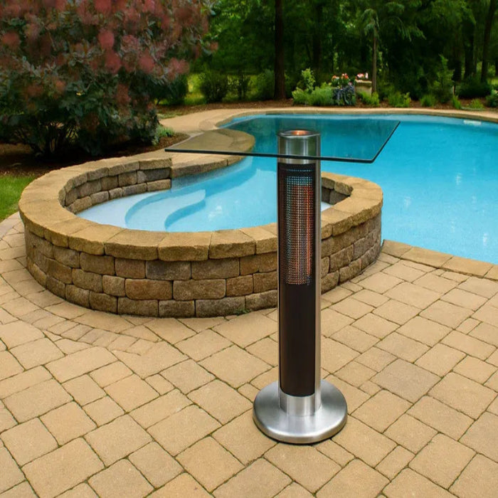 Patio heater on a paved area near a pool with greenery in the background