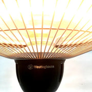 Westinghouse wall-mounted heater with glowing interior on a white background
