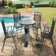 Outdoor patio set with chairs and table near a pool