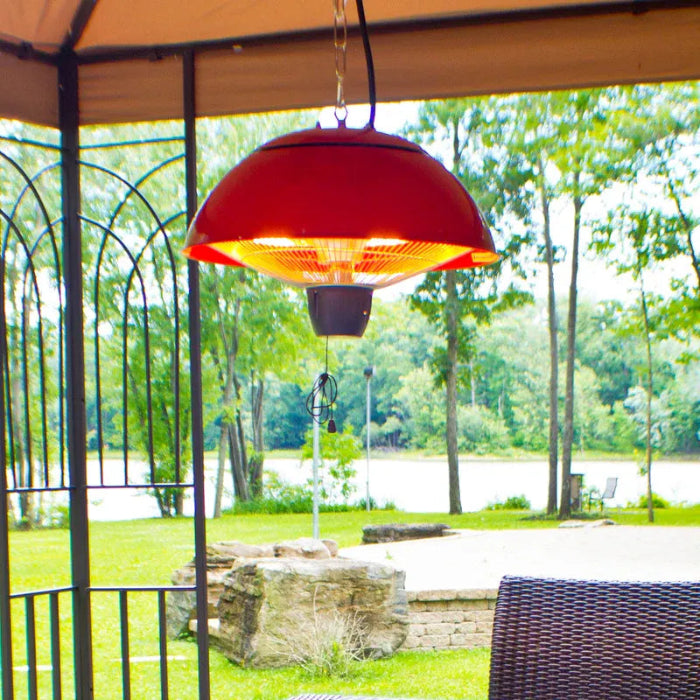 Red outdoor heater hanging from a gazebo with a scenic background of trees and water.